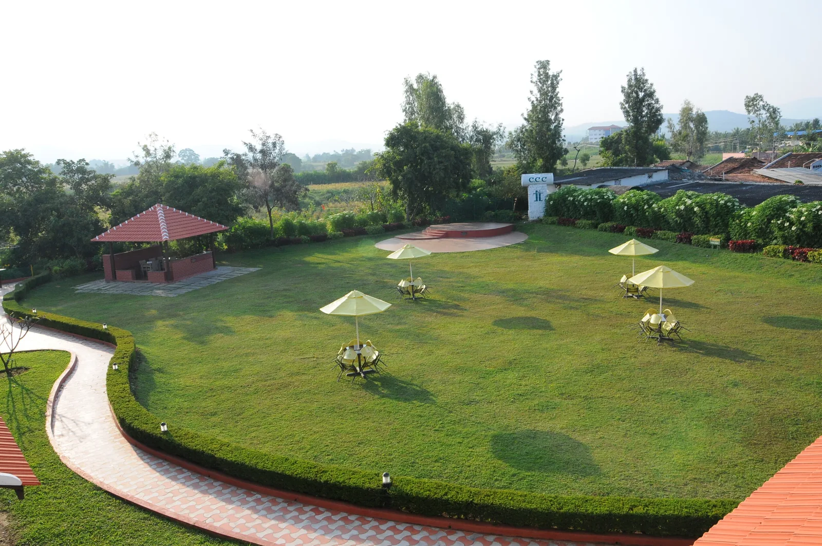 Lawn, outdoor seating and dance-floor area at Chikmagalur Catholic Club