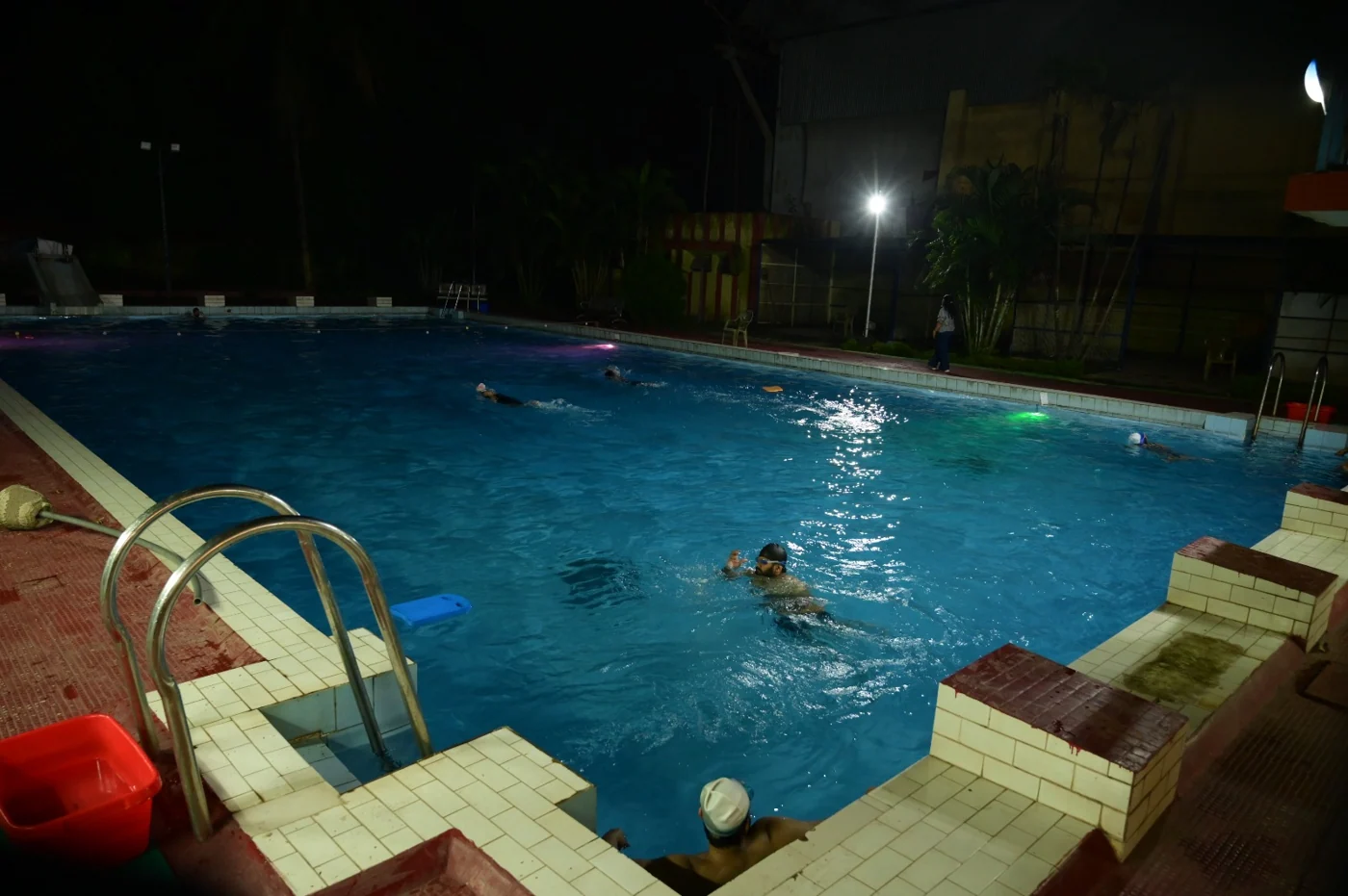 Outdoor swimming pool at Bokaro Club at night