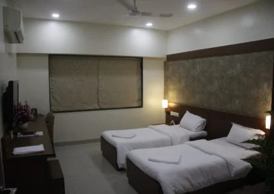 Twin-bed guest room at Deccan Gymkhana