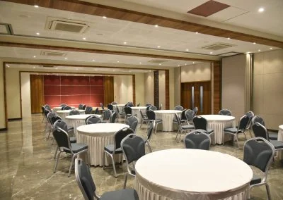 Deccan Gymkhana banquet hall arranged with round tables