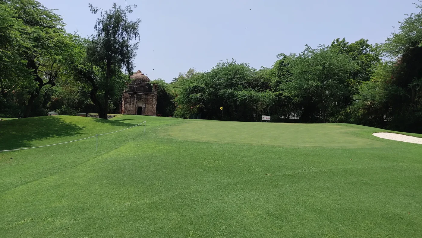 Golf green and tree-lined fairway — The Delhi Golf Club