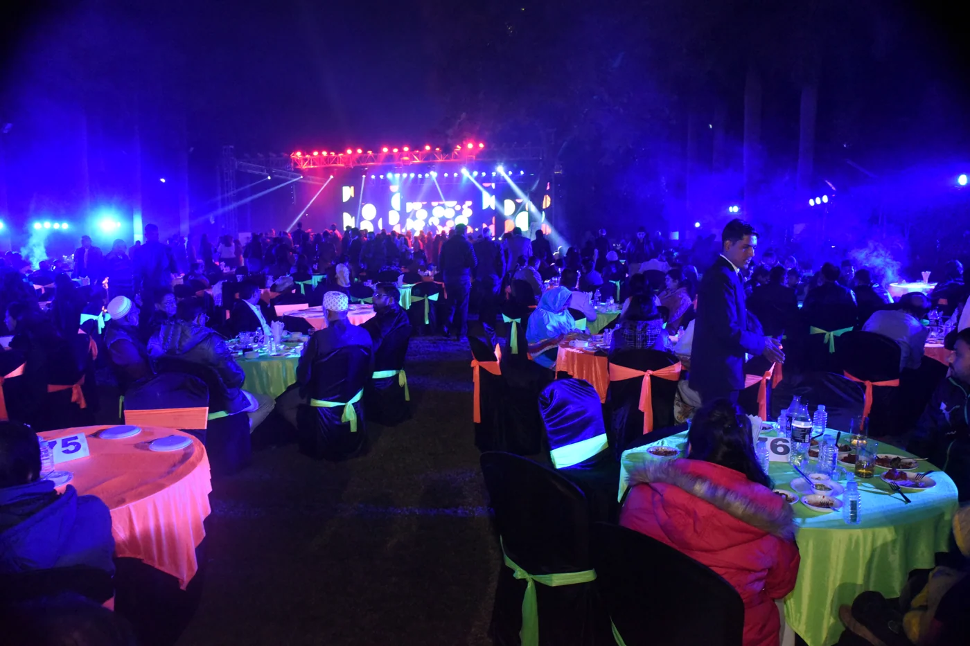 Outdoor evening event and dining setup at Indore Residency Club