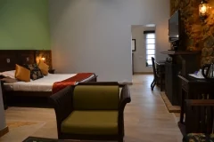 Kodaikanal Club — guest suite seating and bedroom